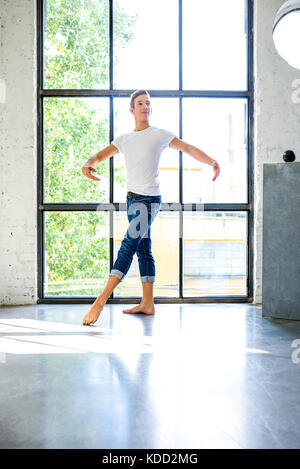 Young handsome male dancer practicing in classical ballet in small studio  with mirrors. Man in white tights. Professional choreographer is working on  Stock Photo - Alamy