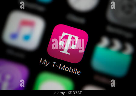 A close-up shot of the logo representing My T-Mobile app icon, as seen on the screen of a smart phone (Editorial use only) Stock Photo