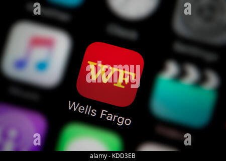 A close-up shot of the logo representing the Wells Fargo app icon, as seen on the screen of a smart phone (Editorial use only) Stock Photo