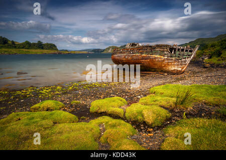 Abandoned boat in Ardvasar harbour, Isle of Skye, Scotland Stock Photo