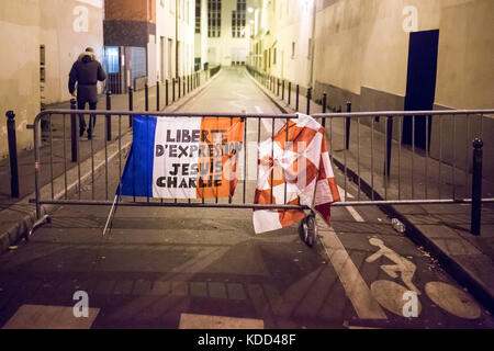 Homage at the victims of Charlie hebdo killing in Paris the 7th of january 2015: french flag je suis charlie and liberty on fences Stock Photo