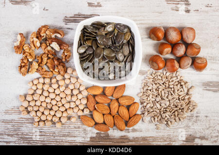 Ingredients or products containing zinc and dietary fiber on old board, natural sources of minerals, healthy lifestyle and nutrition Stock Photo