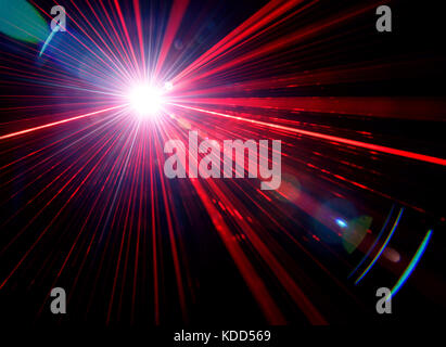 Red stage light effect with lens flare on black background, photo. Stock Photo