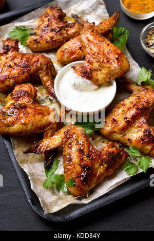 Fried chicken wings with white sauce Stock Photo