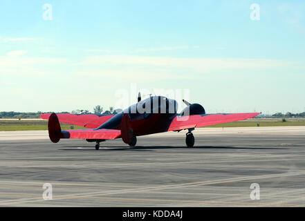 retro propeller airplane taxiing rear view Stock Photo
