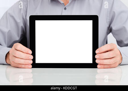 Close-up Of A Man Holding Digital Tablet At Desk Stock Photo