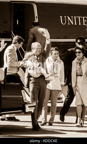 President Jimmy Carter disembarks Marine One holding grandson Jason Carter in his arm beginning an Easter weekend visit to Calhoun, Georgia in 1979. G Stock Photo