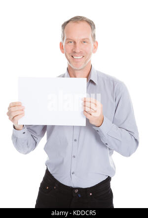 Portrait Of Mature Businessman Holding Placard Over White Background Stock Photo