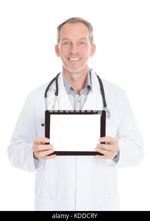 Happy Mature Doctor Showing Tablet Over White Background Stock Photo