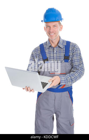 Portrait Of A Male Happy Architect Using Laptop On White Background Stock Photo