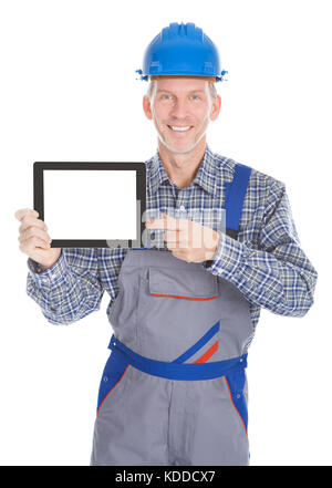 Portrait Of Male Architect Showing Digital Tablet On White Background Stock Photo
