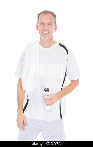 Happy Mature Man  With Towel Holding Water Bottle On White Background Stock Photo