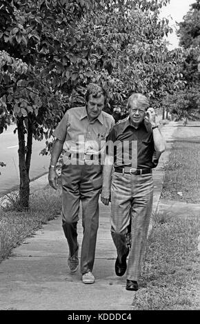 1976 Democratic presidential nominee Jimmy Carter walks through his hometown of Plains, Georgia while talking with former Maine Senator Edmund Muskie. Stock Photo