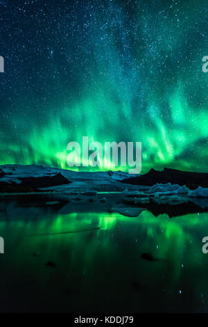 Northern Lights (Aurora Borealis) over Fjallsarlon Glacier and Lagoon in Iceland Stock Photo