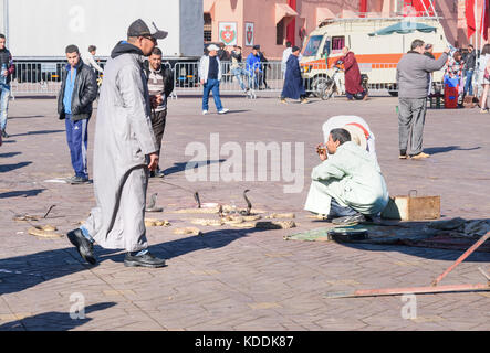 Marrakech, Morocco - December 28, 2017: Snake charmer and snakes on Jeema el Fna square in Marrakesh Stock Photo