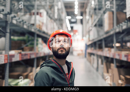 wholesale, logistic, people and export concept - manager or supervisor with tablet at warehouse Stock Photo