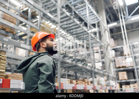 wholesale, logistic, people and export concept - manager or supervisor with tablet at warehouse Stock Photo