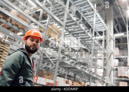 wholesale, logistic, people and export concept - manager or supervisor with tablet at warehouse Stock Photo