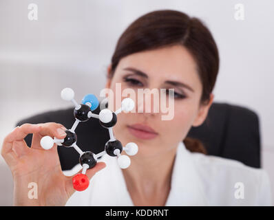 Female Scientist Concentrating On Molecular Structure In Laboratory Stock Photo