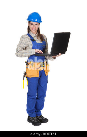 Female Worker Working On Laptop Over White Background Stock Photo