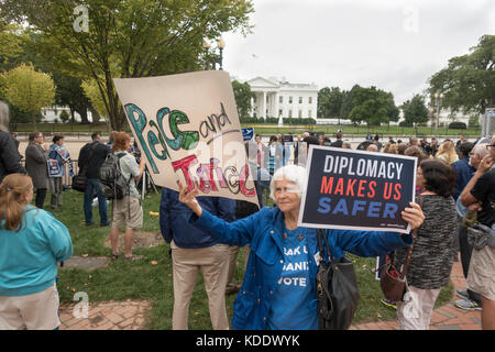 Washington, DC, USA. 12th October, 2017.  Demonstrators in front of the White House protest President Donald Trump's expected decision to unilaterally decertify the 2015 nuclear accord with Iran.  Numerous groups joined in the protest to denounce Trump's decision to 'bring us closer to war' with Iran, rather than continuing diplomacy. Bob Korn/Alamy Live News Stock Photo