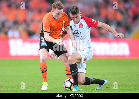 Brisbane, QUEENSLAND, AUSTRALIA. 13th Oct, 2017. Corey Brown of the Roar (#5, left) and Scott Neville of the Wanderers (#12, right) compete for the ball during the round two A-League match between the Brisbane Roar and the Western Sydney Wanderers at Suncorp Stadium on October 13, 2017 in Brisbane, Australia. Credit: Albert Perez/ZUMA Wire/Alamy Live News Stock Photo