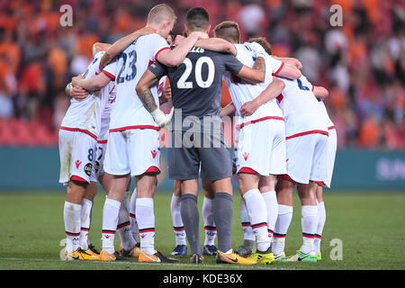 Brisbane, QUEENSLAND, AUSTRALIA. 13th Oct, 2017. Adelaide United players form a huddle after their victory in the round two A-League match between the Brisbane Roar and Adelaide United at Suncorp Stadium on October 13, 2017 in Brisbane, Australia. Credit: Albert Perez/ZUMA Wire/Alamy Live News Stock Photo