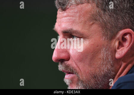 Brisbane, QUEENSLAND, AUSTRALIA. 13th Oct, 2017. Adelaide head coach Marco Kurz speaks to the media after their victory in the round two A-League match between the Brisbane Roar and Adelaide United at Suncorp Stadium on October 13, 2017 in Brisbane, Australia. Credit: Albert Perez/ZUMA Wire/Alamy Live News Stock Photo