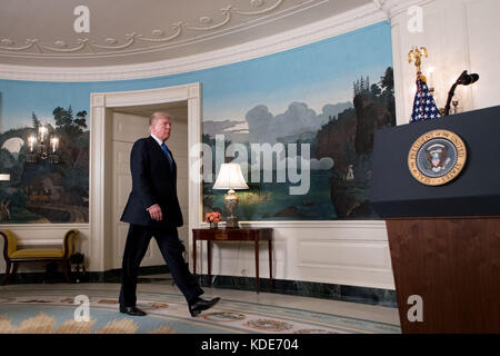 President Donald Trump walks to the podium to deliver brief remarks on ...