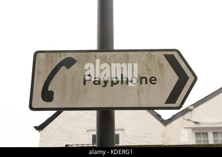 Payphone sign with direction arrow Stock Photo