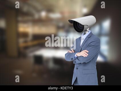 Digital composite of Businessman with CCTV head at office Stock Photo