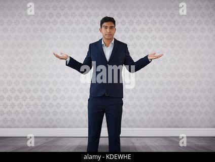 Digital composite of Businessman opening hands confused with decision in room Stock Photo