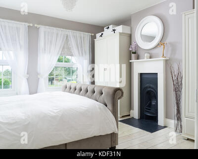 A stylishly decorated bedroom in a refurbished Victorian, UK home. Stock Photo