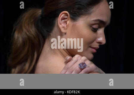 A model wears 'The Raj Pink', the world's largest known 'fancy intense pink diamond' before it is offered at auction, estimated to fetch $20-30 million in Sotheby's Geneva sale of Magnificent and Noble Jewels on 15 November 2017. Stock Photo