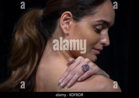 A model wears 'The Raj Pink', the world's largest known 'fancy intense pink diamond' before it is offered at auction, estimated to fetch $20-30 million in Sotheby's Geneva sale of Magnificent and Noble Jewels on 15 November 2017. Stock Photo