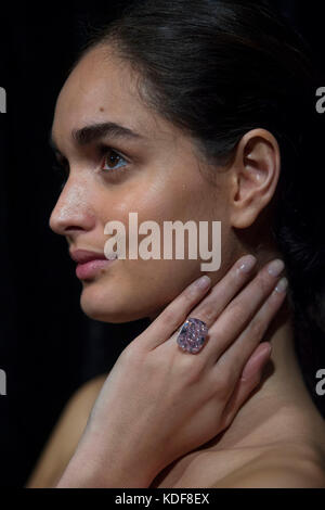 A model wears 'The Raj Pink', the world's largest known 'fancy intense pink diamond' before it is offered at auction, estimated to fetch $20-30 million in Sotheby's Geneva sale of Magnificent and Noble Jewels on 15 November 2017. Stock Photo