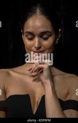 A model wears 'The Raj Pink', the world's largest known 'fancy intense pink diamond' before it is offered at auction, estimated to fetch $20-30 million in Sotheby's Geneva sale of Magnificent and Noble Jewels on 15 November 2017. Stock Photo