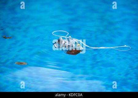 Underwater photo camera housing floating in a swimming pool Stock Photo