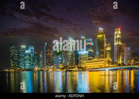 Singapore - February 19 2017: Singapore Cityscape Financial building with Dramatic Cloud in Marina Bay area Singapore at  Dusk Stock Photo