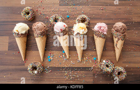 Variety of ice creams in waffle cones with chocolate and sprinkles Stock Photo
