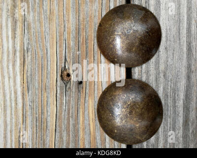 two blacksmith nails on a table Stock Photo