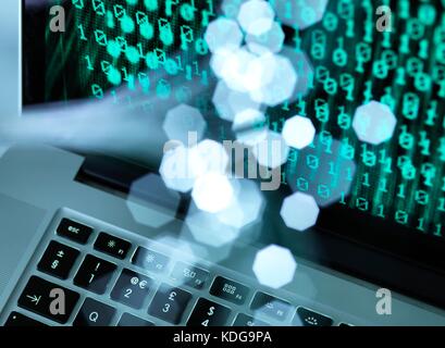 Fibre optic data containing a computer virus hitting a laptop screen. Stock Photo