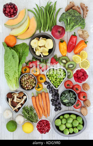 Super food nutrition concept for healthy eating with foods of fruit, vegetables, nuts, herbs and spice high in antioxidants, anthocyanins and  fibre. Stock Photo