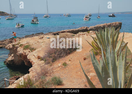 Rock and yachts in bay Cala Xinxell. Palma-de-Mallorca, Spain Stock Photo