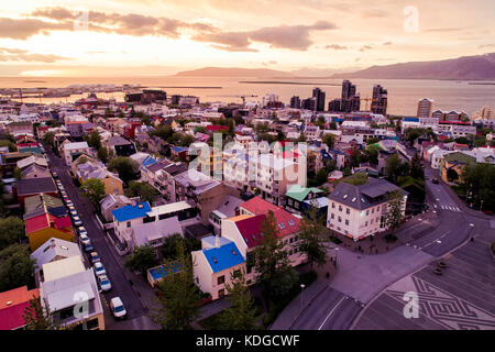 Aerial of Reykjavik city in spring, shot over Skolavorduholt looking towards the harbor and downtown Stock Photo