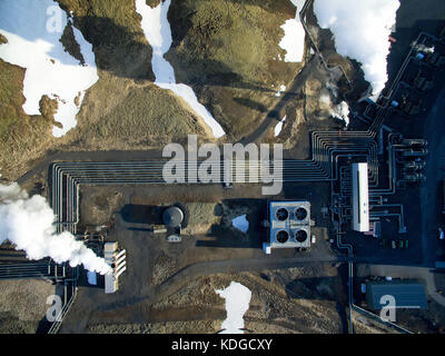 Aerial photograph of Hellisheidi geothermal powerplant in iceland, shot in springtime with snow on the ground close by Stock Photo