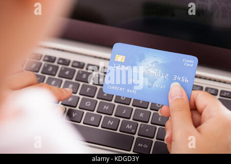 Close-up Of Female Hand With Credit Card Shopping Online Stock Photo