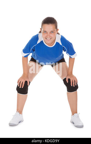 Portrait of a happy female Volleyball player over white background Stock Photo