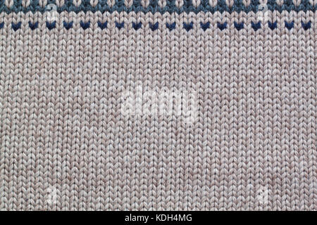 Grey and beige realistic knitting pattern. Wool. Stock Photo