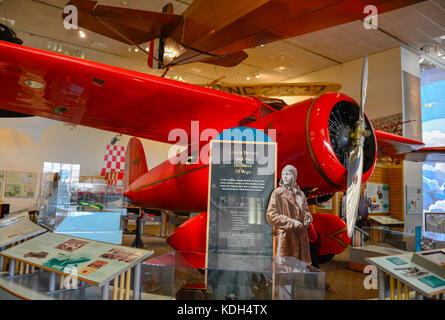 An exhibit of Amelia Earhart's plane, the Lockheed 5B Vega, with historical photo displays at the National Air and Space Museum in Washington, DC, USA Stock Photo